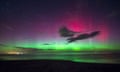 A view of the northern lights seen from Bamburgh Castle Beach, Northumberland.