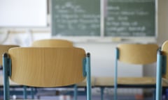 school chairs in front of blackboard