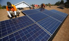 Technicians installing solar panels