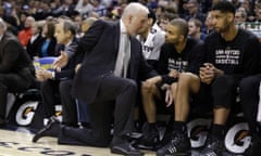 San Antonio Spurs head coach Gregg Popovich talks with two players who have played a major role in his 1,000 NBA wins: Tony Parker and Tim Duncan.