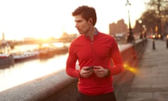 Man runs by the river in London at dawn