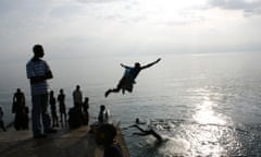 Men dive in Lake Kivu, Kisegi, Rwanda