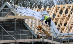 Builder on the roof of a house