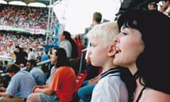 A young Jonnie Peacock and his mum Linda watching a sports match.
