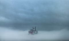 The steamboat Natchez disappears into the fog on the Mississippi River.