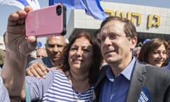 A supporter takes a selfie with Israeli