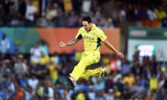 Australian paceman Mitchell Johnson celebrates after bowling India's batsman Rohit Sharma