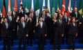 US President Barack Obama (2nd R) waves with other world leaders as they take part in the G20 "family photo" during the G20 Summit in Brisbane on November 15, 2014. Australia is hosting the leaders of the world's 20 biggest economies for the G20 summit in Brisbane on November 15 and 16. AFP PHOTO / Saeed KHANSAEED KHAN/AFP/Getty Images