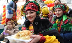 A woman holds plate of pancakes to mark the end of Maslenitsa (Shrovetide) in Kyrgyzstan's capital Bishkek last month.