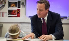 Prime Minister David Cameron helps with a reading lesson at the Sacred Heart Roman Catholic Primary School in Westhoughton near Bolton with six year old Lucy Howarth, while on the General Election campaign trail. PRESS ASSOCIATION Photo. Picture date: Wednesday April 8, 2015. See PA story ELECTION Main. Photo credit should read: Stefan Rousseau/PA Wire