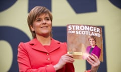 Scotland’s first minister, Nicola Sturgeon poses with a copy of the SNP manifesto at the launch in Edinburgh on Monday.