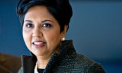 Portrait of Indra Nooyi in business jacket and pearl earrings and necklace