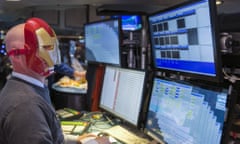 A trader wears an Iron Man mask on the day that cast members of the film Avengers: Age of Ultron visit the stock exchange in New York.