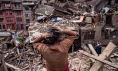 A Nepalese earthquake victims looks on among debris of collapsed buildings on April 29, 2015 in Bhaktapur
