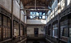 The Old Beijing Stock Exchange was built in 1918. A light-filled, two-story gallery surrounded by wooden pilasters sits in the centre of the building.