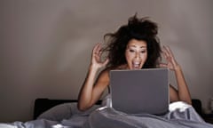woman bed laptop