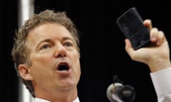 Rand Paul holds up his cellphone to make a point about NSA surveillance.