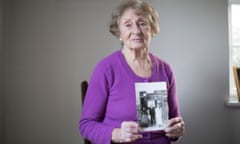 Susan Pollack holds a picture of her with her parents, who were killed in the Holocaust.