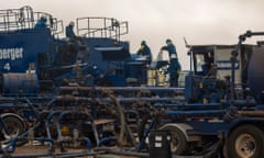 Schlumberger employees work during an oil fracking process in Vaca Muerta in the Patagonian province of Neuquen, Argentina, Sept. 20, 2013.