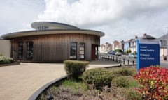 Image of a wooden clad round modern building.