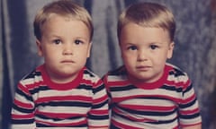 Twins Gary and Ryan Jarman, dressed in the same stripy tops, as children