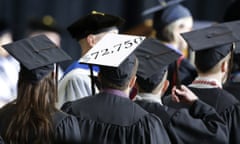 A student in line for his diploma wears a cap decorated with the cost of his education during graduation ceremonies at the University of Idaho in Moscow, Idaho., Saturday, May 16, 2015. (AP Photo/Orlin Wagner)