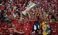 Sevilla players celebrate with trophy.