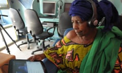 TO GO WITH AFP STORY BY COUMBA SYLLA Boury Guiss  uses a tablet computer in the world's first cybercafe equipped with tablet computers, in the Medina, a popular district of Dakar, on May 28, 2013. The owner, Medoune Seck, replaced in May his computers by tablet computers, with the help of US Internet giant Google. AFP PHOTO / SEYLLOU        (Photo credit should read SEYLLOU/AFP/Getty Images)