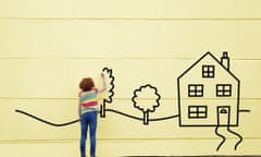 Girl drawing a house and trees onto a wall