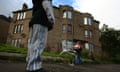 GLASGOW, UNITED KINGDOM - SEPTEMBER 30:  Two young boys play football  in a run down street with boarded up houses, September 30, 2008 in the Govan area of Glasgow, Scotland.