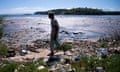 NITEROI, BRAZIL - JULY 30:  A man walks along the shoreline of the polluted waters of Guanabara Bay near Rio de Janeiro on July 30, 2014 in Niteroi, Brazil. The iconic bay will be the site of sailing events during the Rio 2016 Olympic Games. Although Rio's Olympic bid included the promise to clean up the filthy bay, industrial and human pollution still remain a major problem. According to the Deputy State Secretary of Environment just 34% of Rio's sewage is treated while the remainder flows untreated into the waters.  (Photo by Buda Mendes/Getty Images)Pollution