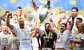 Saracens celebrate with the Premiership trophy after beating Bath at Twickenham.