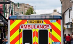 An ambulance in a busy high street