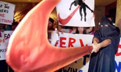 A group of garment workers protest against Nike claiming they were laid off without compensation from a Thai factory that produced garments for Nike after the factory closed down.