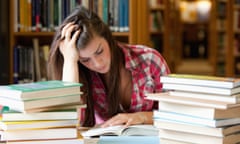 student studying books.