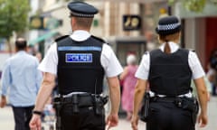 Police officers walking in a town centre