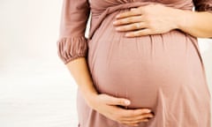 pregnant woman holding bump