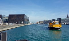 Movia water bus approaches the Royal Danish Library stop on the waterfront in Copenhagen, Denmark