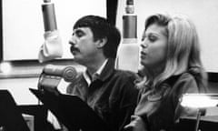 Singer Nancy Sinatra with songwriter and record producer Lee Hazlewood recording in the studio circa 1966. 