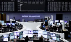 Traders are pictured at the stock exchange in Frankfurt.