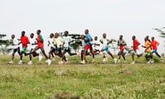 A group of runners including marathon world record holder Paul Tergat go for an early morning training run in the Ngong Hills in Kenya.