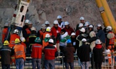 Miner Claudio Yanez kisses his wife after arriving as the eighth of 33 miners to be hoisted to the surface in a dramatic rescue near Copiapo on 13 October 2010.