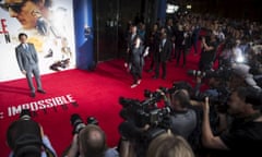 Actor Tom Cruise poses for photographers at the London premiere of Mission: Impossible - Rogue Nation