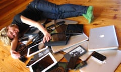 woman cuddling multiple computer mobile devices