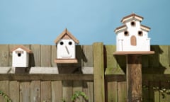 Birdhouses on a fence