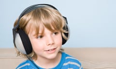 A boy listens to an audiobook