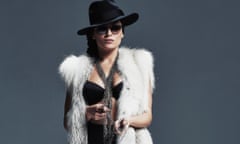 Singer-songwriter Melody Gardot wears ermine stole, a black fedora and dark sunglasses