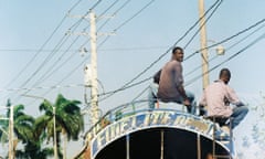 Two men on a tap tap, Port au Prince, Haiti.