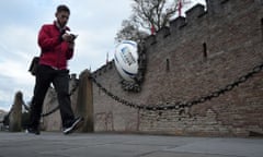 A giant rugby ball breaks the wall of Cardiff castle ahead of the 2015 Rugby Union World Cup.