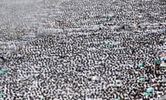 Muslim pilgrims decked in white perform the noon prayer on the outskirts of Mecca.
